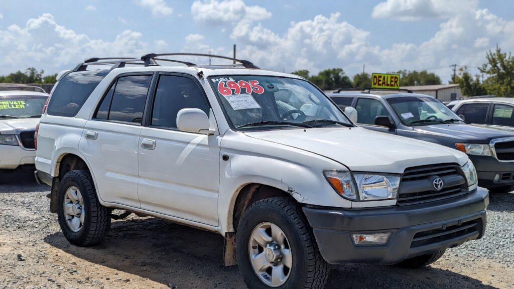 1999 Toyota 4Runner with for sale sign at used car lot