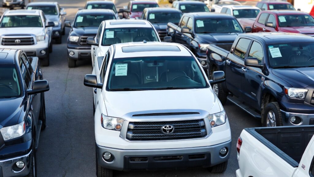2007 Toyota Tundra parked in a used truck lot with price context and other vehicles.