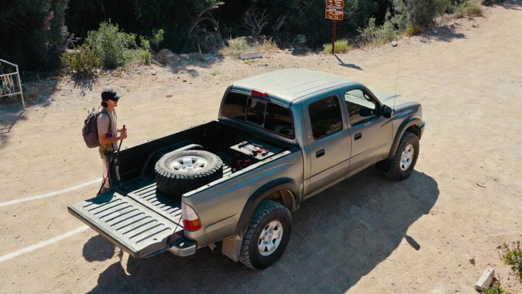 budget buyer with 03 Toyota Tacoma at trailhead showing lifestyle fit